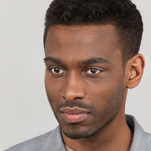 Neutral black young-adult male with short  brown hair and brown eyes