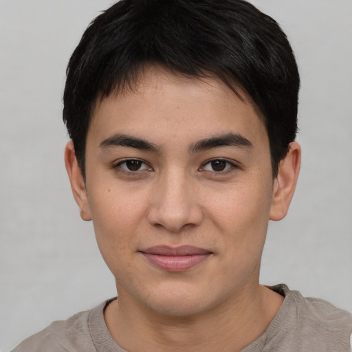 Joyful asian young-adult male with short  black hair and brown eyes