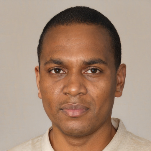 Neutral black adult male with short  black hair and brown eyes