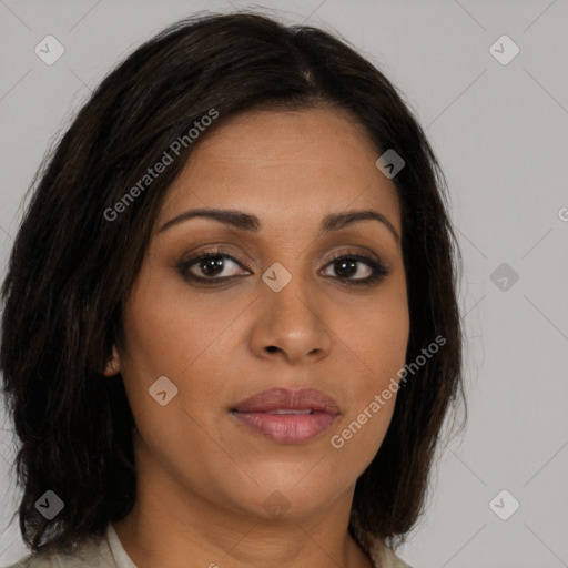 Joyful latino young-adult female with long  brown hair and brown eyes