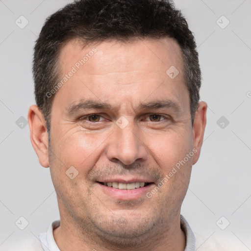 Joyful white adult male with short  brown hair and brown eyes