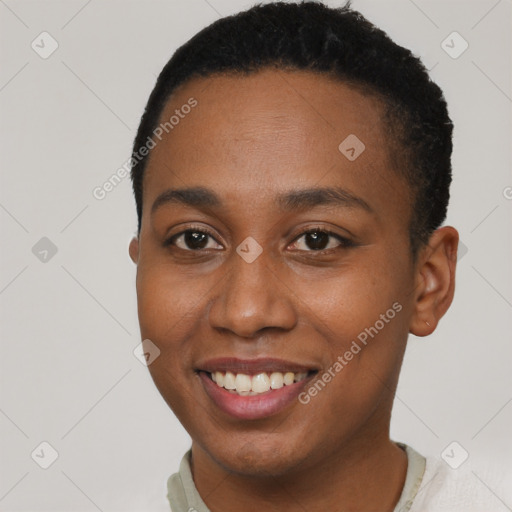 Joyful black young-adult female with short  brown hair and brown eyes