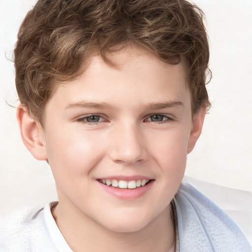 Joyful white child male with short  brown hair and brown eyes