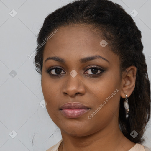 Joyful black young-adult female with medium  brown hair and brown eyes