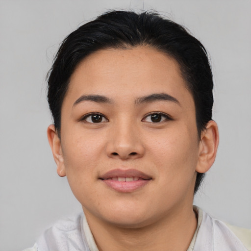 Joyful asian young-adult female with short  brown hair and brown eyes