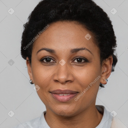 Joyful latino adult female with short  black hair and brown eyes