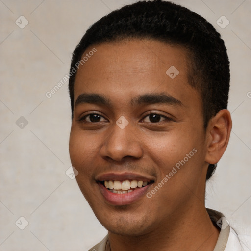 Joyful black young-adult male with short  black hair and brown eyes