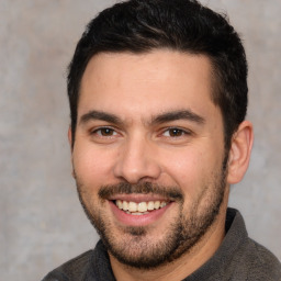 Joyful white young-adult male with short  black hair and brown eyes