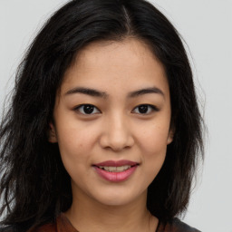 Joyful asian young-adult female with long  brown hair and brown eyes