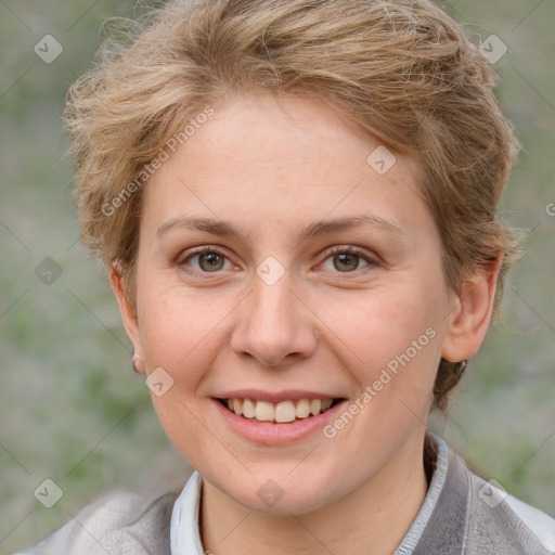 Joyful white adult female with medium  brown hair and blue eyes