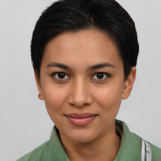 Joyful white young-adult female with short  black hair and brown eyes