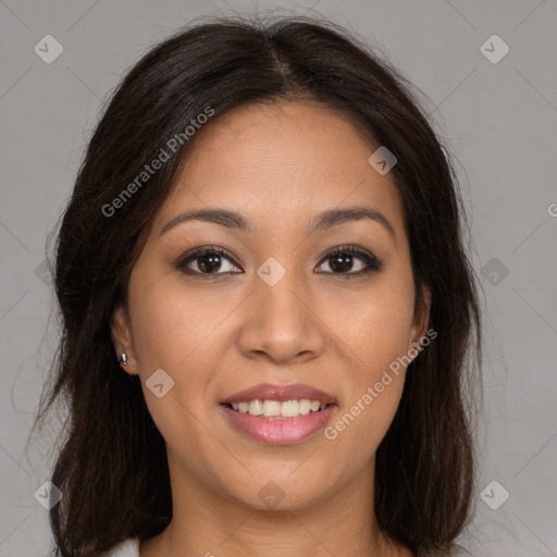 Joyful black young-adult female with long  brown hair and brown eyes