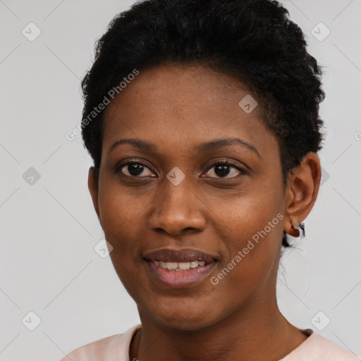 Joyful black young-adult female with short  black hair and brown eyes