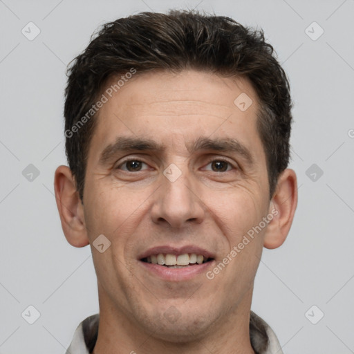 Joyful white adult male with short  brown hair and brown eyes