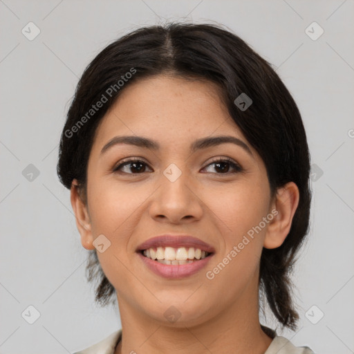 Joyful latino young-adult female with medium  brown hair and brown eyes