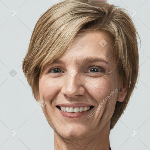 Joyful white adult female with long  brown hair and blue eyes