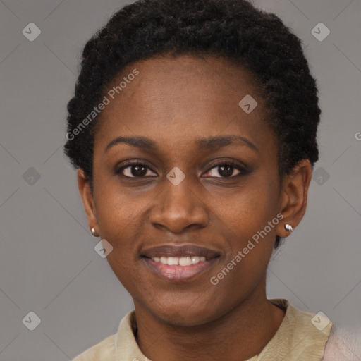 Joyful black young-adult female with short  brown hair and brown eyes