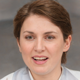 Joyful white young-adult female with medium  brown hair and grey eyes