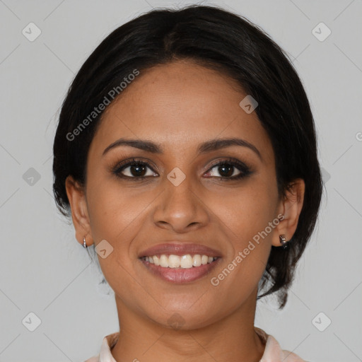 Joyful black young-adult female with medium  brown hair and brown eyes