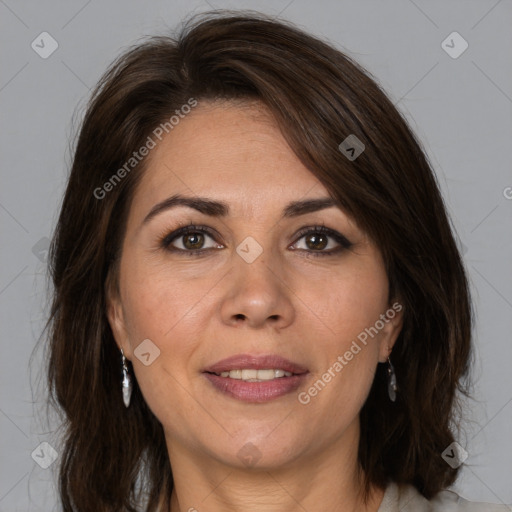 Joyful white adult female with medium  brown hair and brown eyes