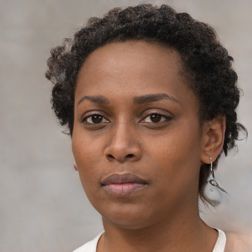 Neutral black young-adult female with short  brown hair and brown eyes