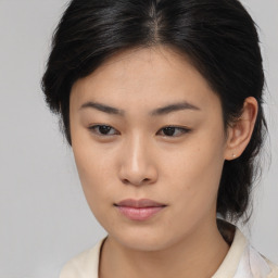 Neutral asian young-adult female with medium  brown hair and brown eyes