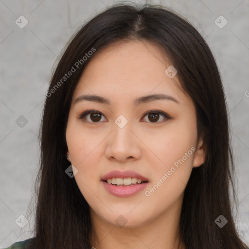 Joyful asian young-adult female with long  brown hair and brown eyes