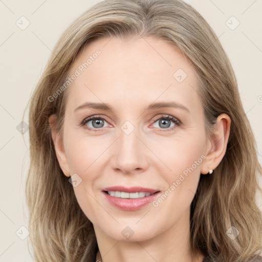 Joyful white young-adult female with long  brown hair and blue eyes