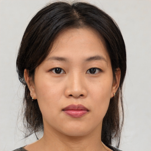 Neutral asian young-adult female with medium  brown hair and brown eyes