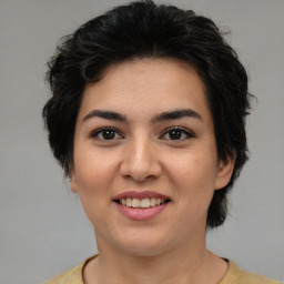 Joyful asian young-adult female with medium  brown hair and brown eyes