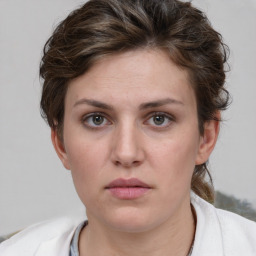 Neutral white young-adult female with short  brown hair and grey eyes