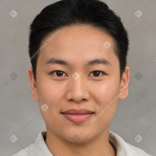 Joyful asian young-adult male with short  brown hair and brown eyes