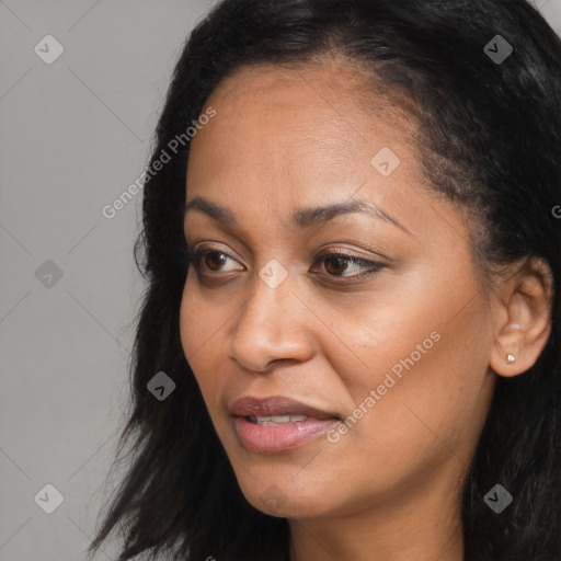 Joyful black young-adult female with long  brown hair and brown eyes