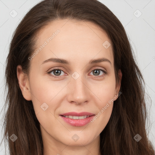 Joyful white young-adult female with long  brown hair and grey eyes