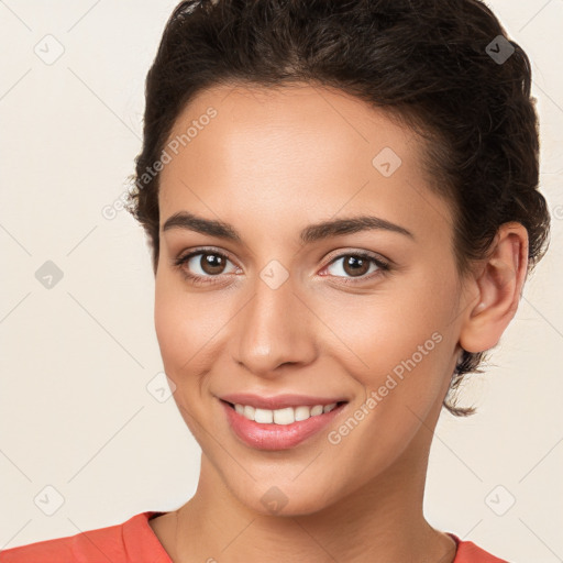 Joyful white young-adult female with short  brown hair and brown eyes