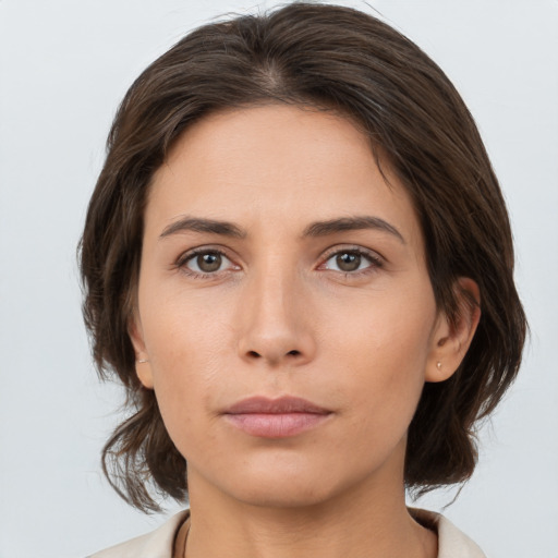 Neutral white young-adult female with medium  brown hair and brown eyes