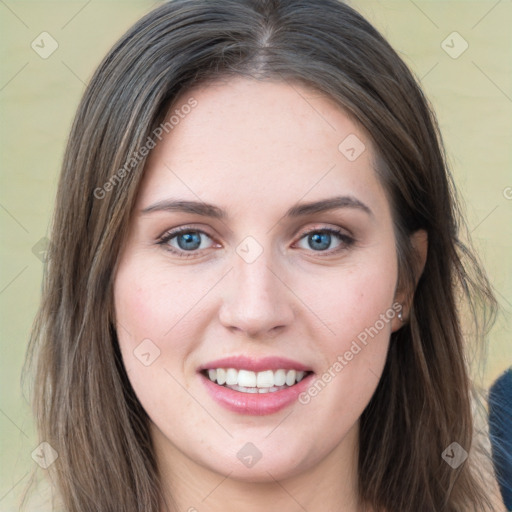 Joyful white young-adult female with long  brown hair and blue eyes