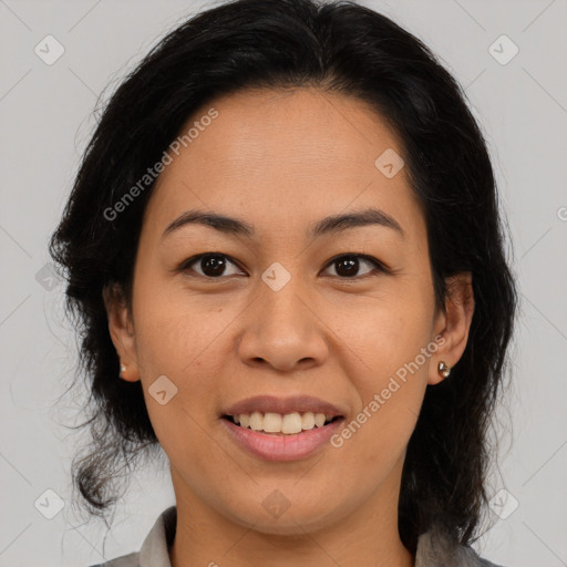 Joyful latino young-adult female with medium  brown hair and brown eyes