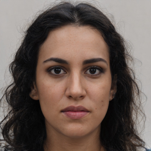 Neutral latino young-adult female with long  brown hair and brown eyes
