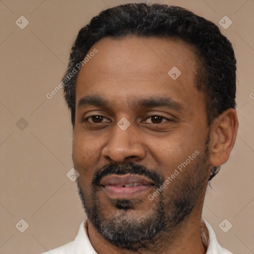Neutral latino adult male with short  black hair and brown eyes