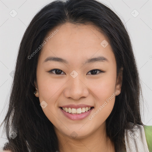 Joyful asian young-adult female with long  brown hair and brown eyes