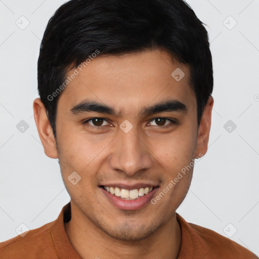 Joyful latino young-adult male with short  brown hair and brown eyes