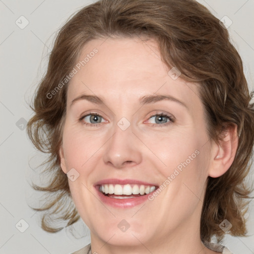 Joyful white young-adult female with medium  brown hair and blue eyes