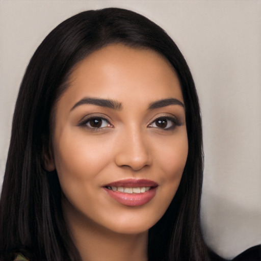 Joyful latino young-adult female with long  black hair and brown eyes