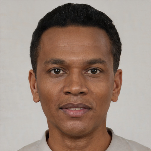 Neutral black young-adult male with short  black hair and brown eyes