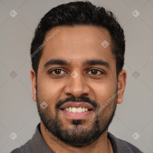 Joyful black young-adult male with short  black hair and brown eyes