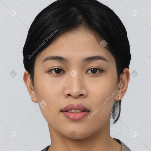 Joyful asian young-adult female with short  black hair and brown eyes