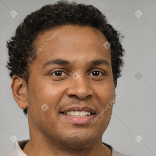 Joyful latino young-adult male with short  brown hair and brown eyes