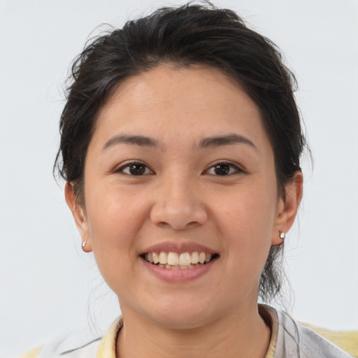 Joyful white young-adult female with medium  brown hair and brown eyes