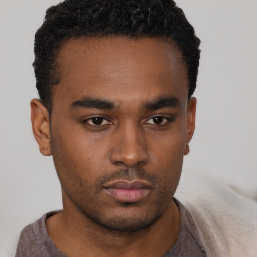 Neutral black young-adult male with short  black hair and brown eyes
